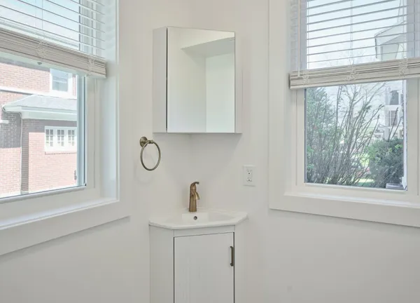 a bathroom with a sink and a window