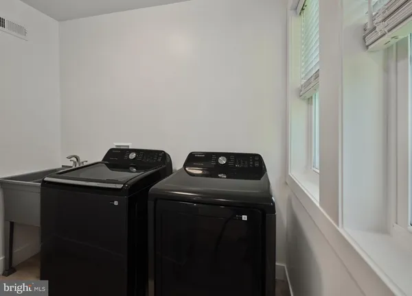 a bathroom with a sink and vanity