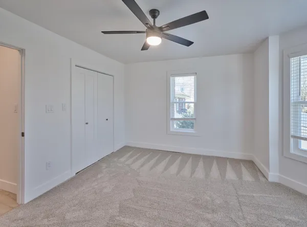 a view of an empty room with a window