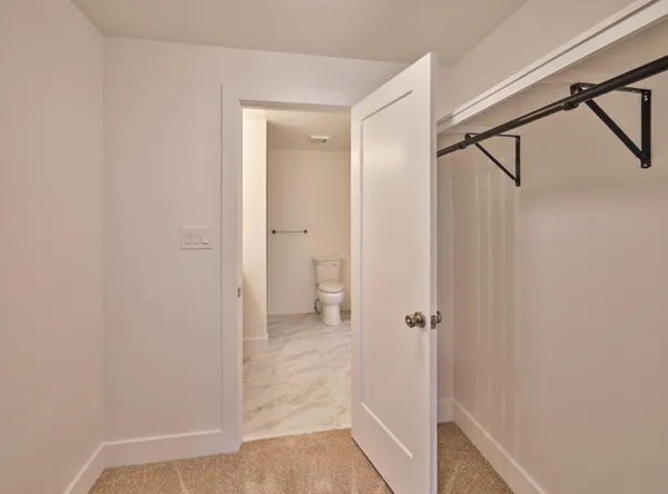 a bathroom with a granite countertop shower