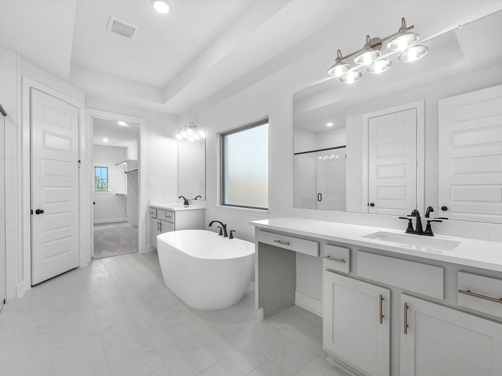 4911 Benton Wds Trail Rosenberg, TX 77471 - Photo 15 of 29 a bathroom with a double vanity sink mirror and bathtub