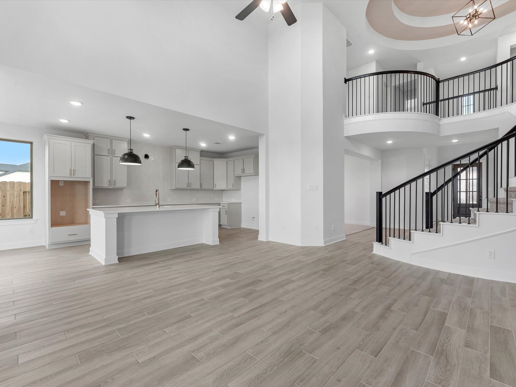 4911 Benton Wds Trail Rosenberg, TX 77471 - Photo 6 of 29 a view of kitchen with cabinets stainless steel appliances wooden floor and a chandelier