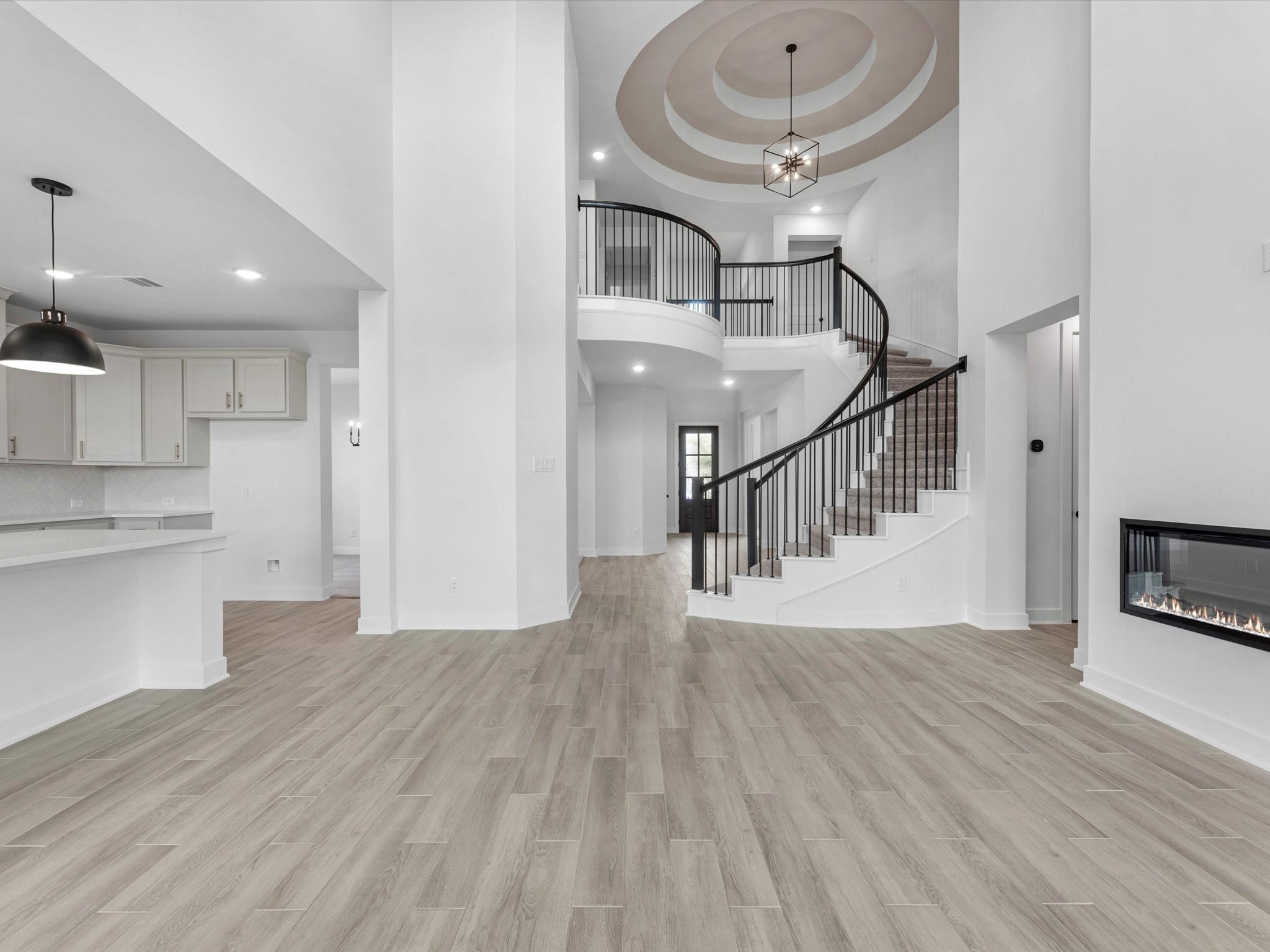 4911 Benton Wds Trail Rosenberg, TX 77471 - Photo 7 of 29 a view of staircase and kitchen with wooden floor