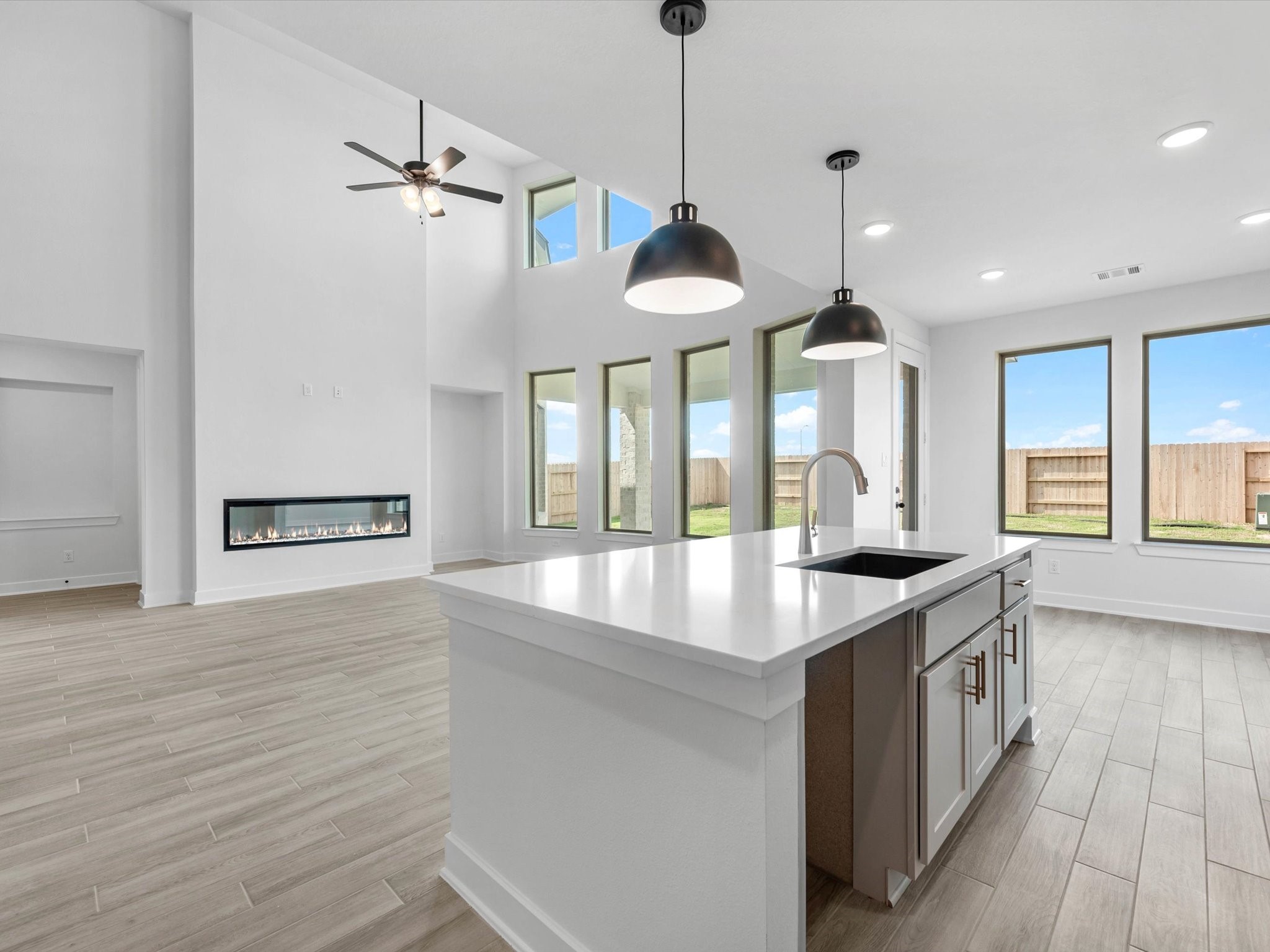 4911 Benton Wds Trail Rosenberg, TX 77471 - Photo 10 of 29 a kitchen with stainless steel appliances granite countertop a sink a counter space and a window