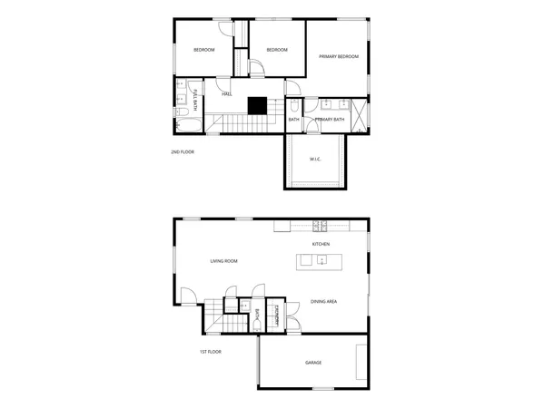 a bedroom with a bed table and a window