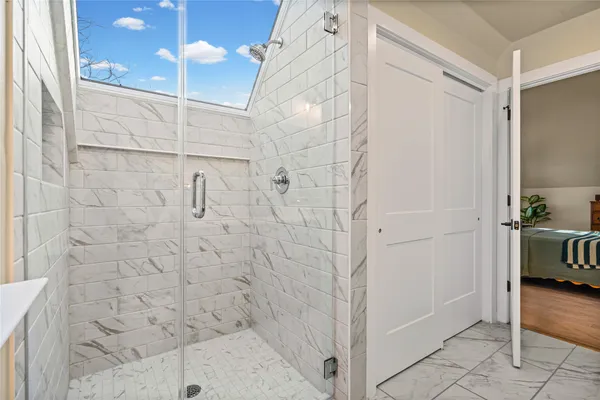 a bathroom with a sink toilet and a mirror