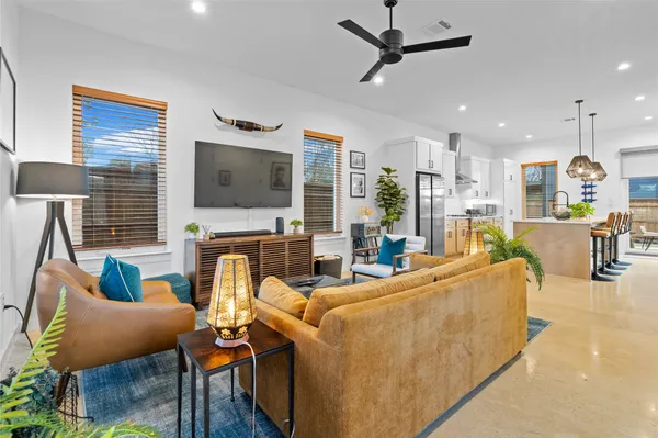 a living room with furniture and a flat screen tv