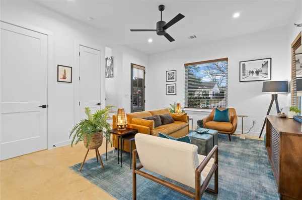 a living room with furniture and a large window