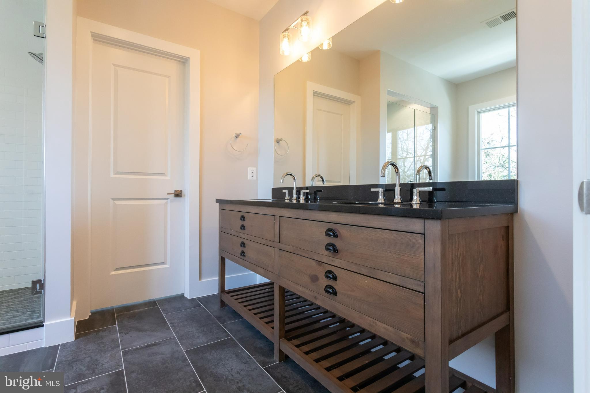 734 North Wakefield Street Arlington, VA 22203 - Photo 14 of 26 a bathroom with a sink and a mirror
