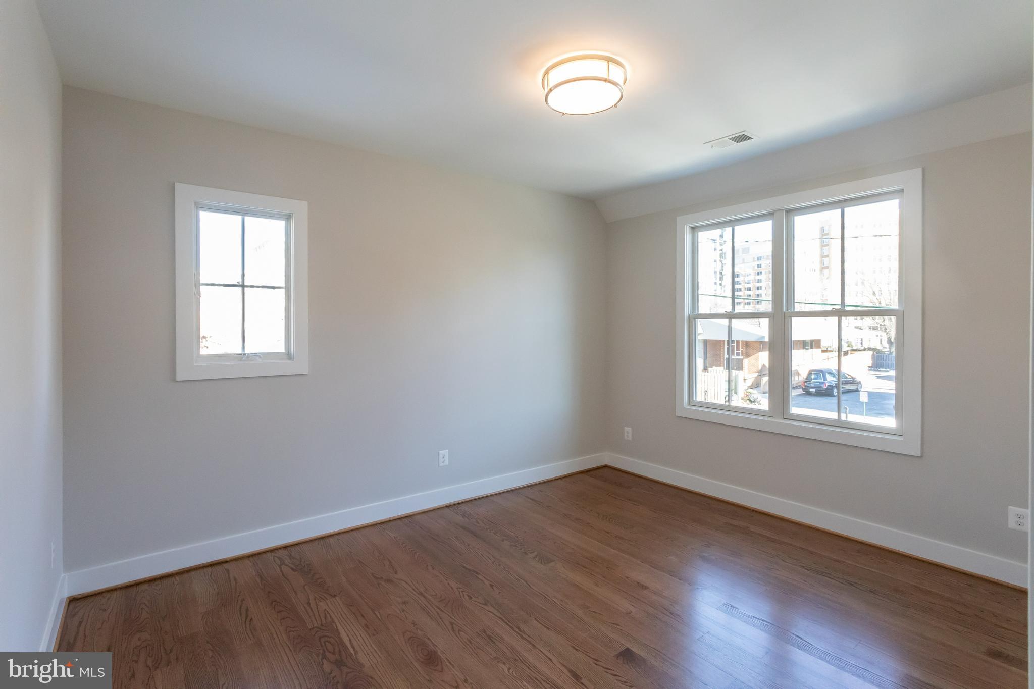 734 North Wakefield Street Arlington, VA 22203 - Photo 22 of 26 an empty room with wooden floor and windows