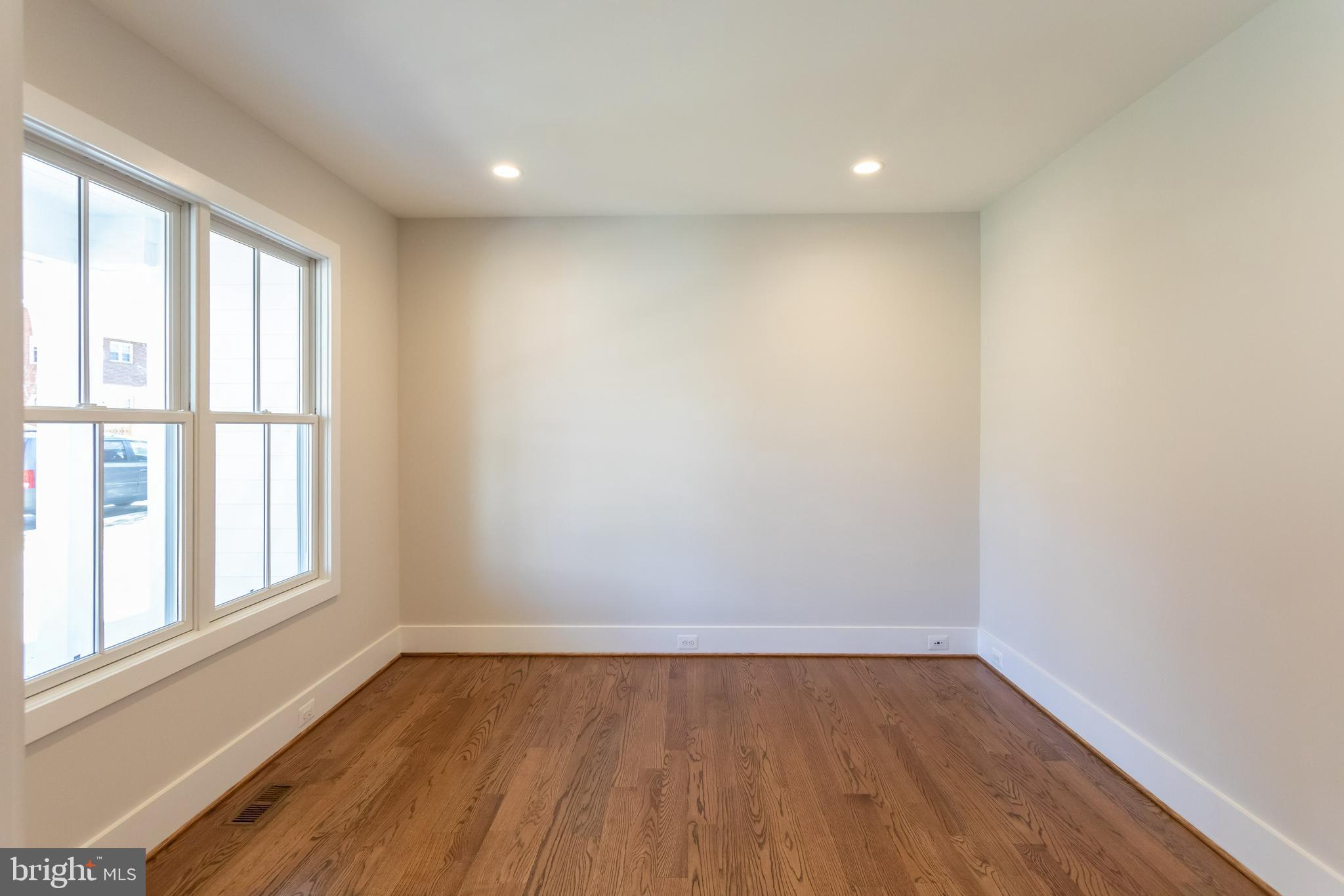 734 North Wakefield Street Arlington, VA 22203 - Photo 25 of 26 an empty room with wooden floor and windows