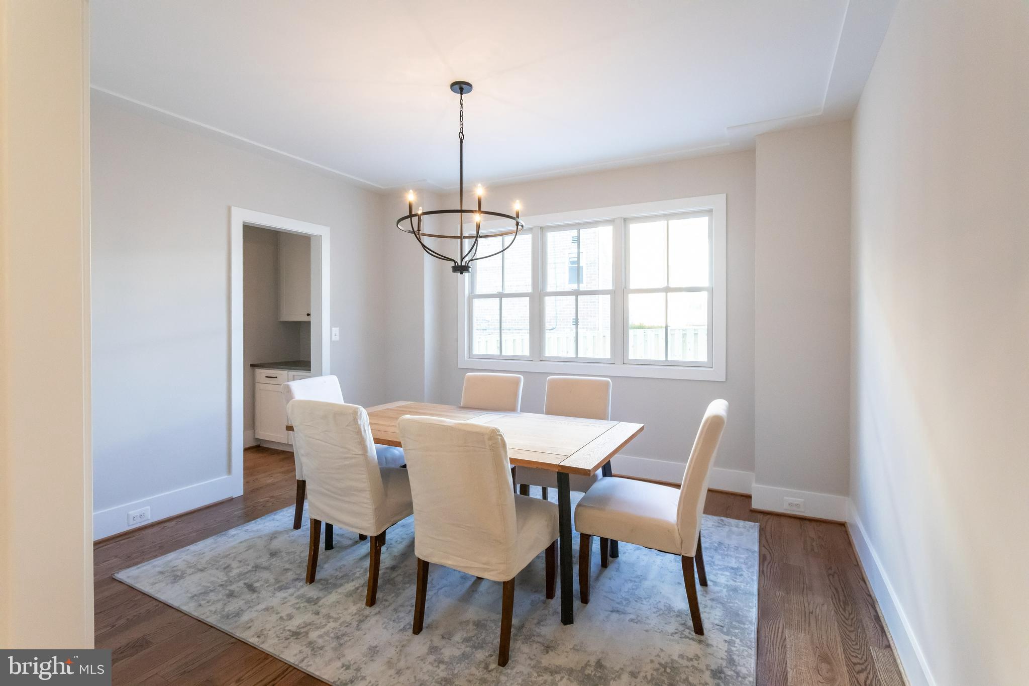 734 North Wakefield Street Arlington, VA 22203 - Photo 7 of 26 a view of a dining room with furniture window and wooden floor