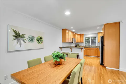 a kitchen with a table and chairs