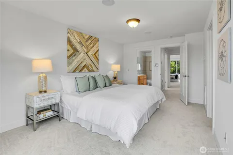 a bedroom with a bed and a lamp