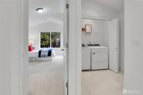 a view of utility room and front door