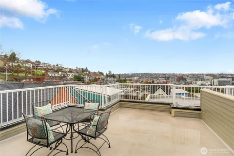 a view of a balcony with furniture