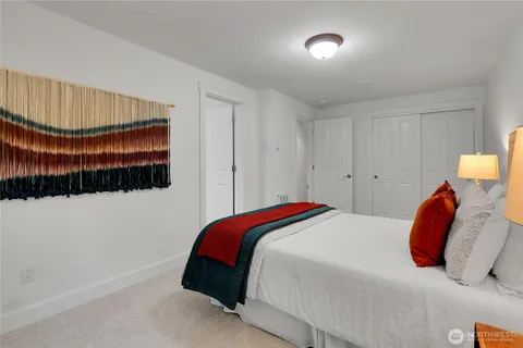 a bedroom with a bed and a walk in closet