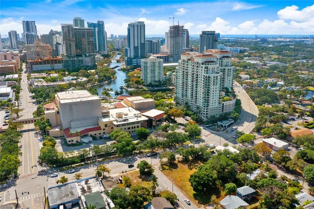 an aerial view of a house with a yard and garden