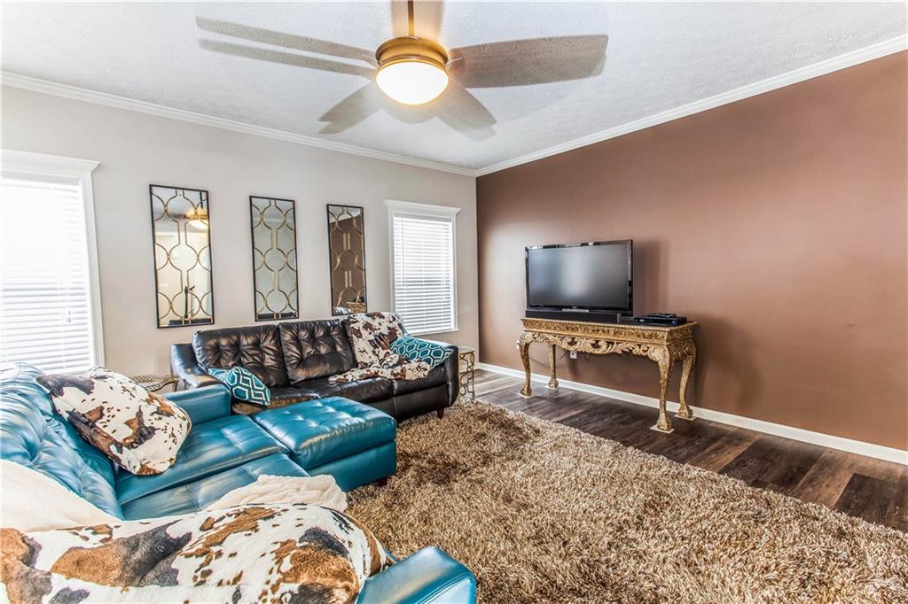 211 West Country Barn Road Houston, PA 15342 - Photo 5 of 25 The Living Room Features a Ceiling Fan, 9' Ceilings, Crown Molding & Tons of Natural Light!