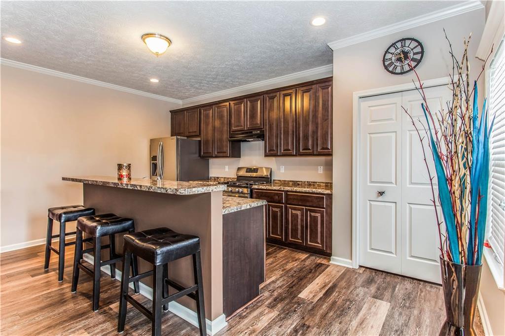 211 West Country Barn Road Houston, PA 15342 - Photo 8 of 25 The Tiered Kitchen Island Serves as a Breakfast Bar!