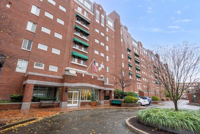 a view of a building with a yard