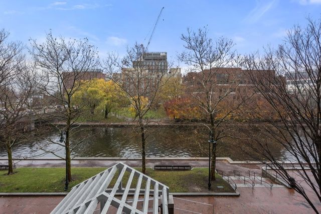 a view of a balcony with yard