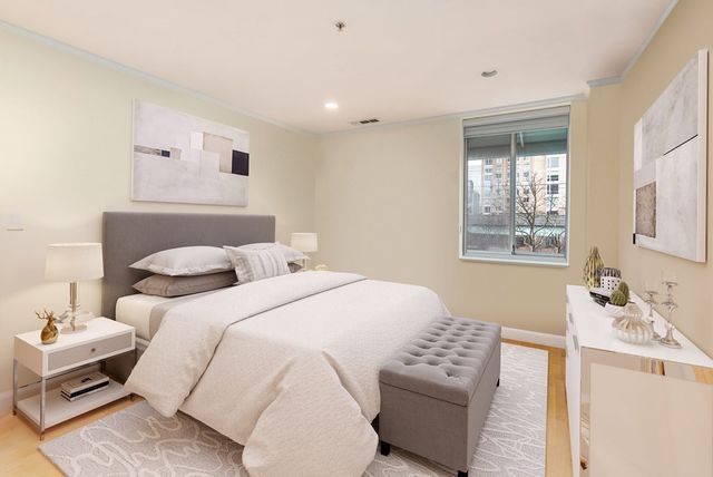 a bedroom with a bed and a couch