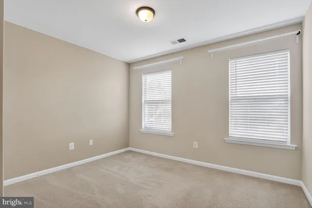 a view of storage and utility room with racks on the wall