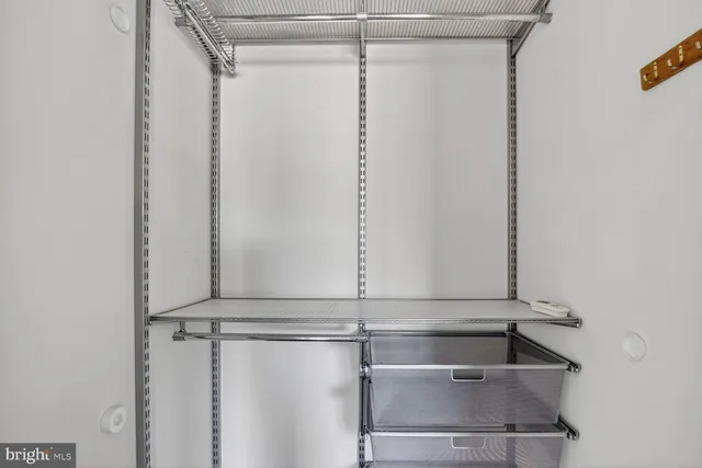 a view of hallway with wooden floor