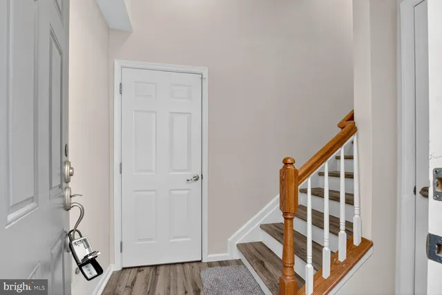 a view of an entryway with wooden floor