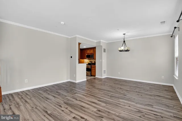 a front view of a house with a garden and plants