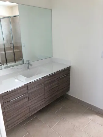 a bathroom with a sink and vanity