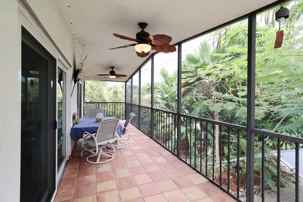 a view of a livingroom with furniture and garden view