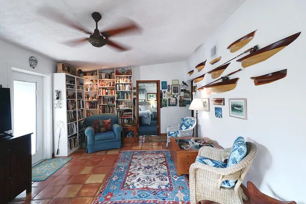 a living room with furniture and a lamp