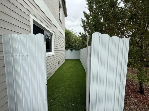 a view of a back yard of the house