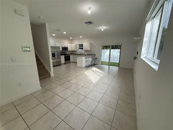 a view of kitchen with furniture and window
