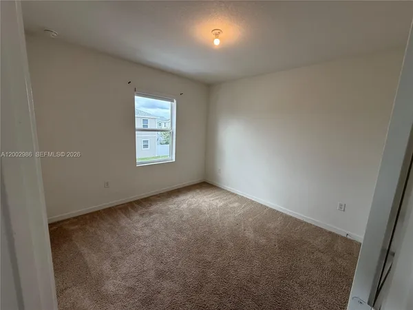 a view of an empty room and window