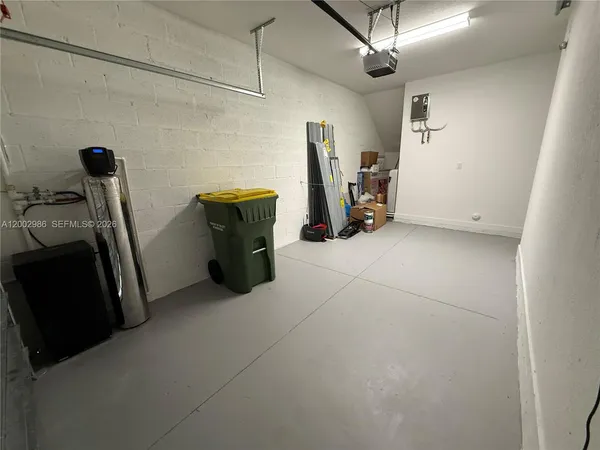a view of a storage & utility room with two washing machine