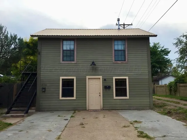 a front view of a house with garage