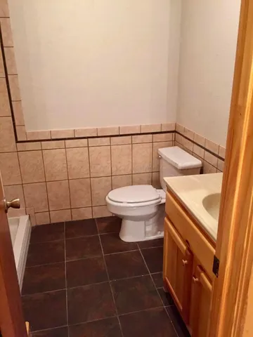 a bathroom with a toilet and a sink
