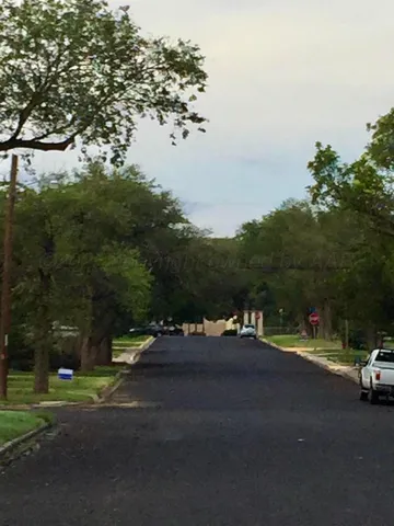 a view of street with parked cars