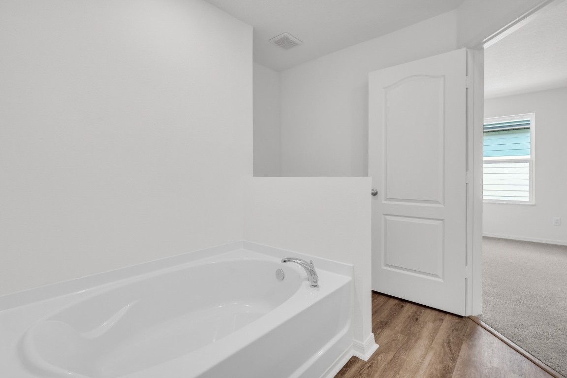 37255 Whisper Way Hilliard, FL 32046 - Photo 15 of 20 a white bath tub sitting next to a window