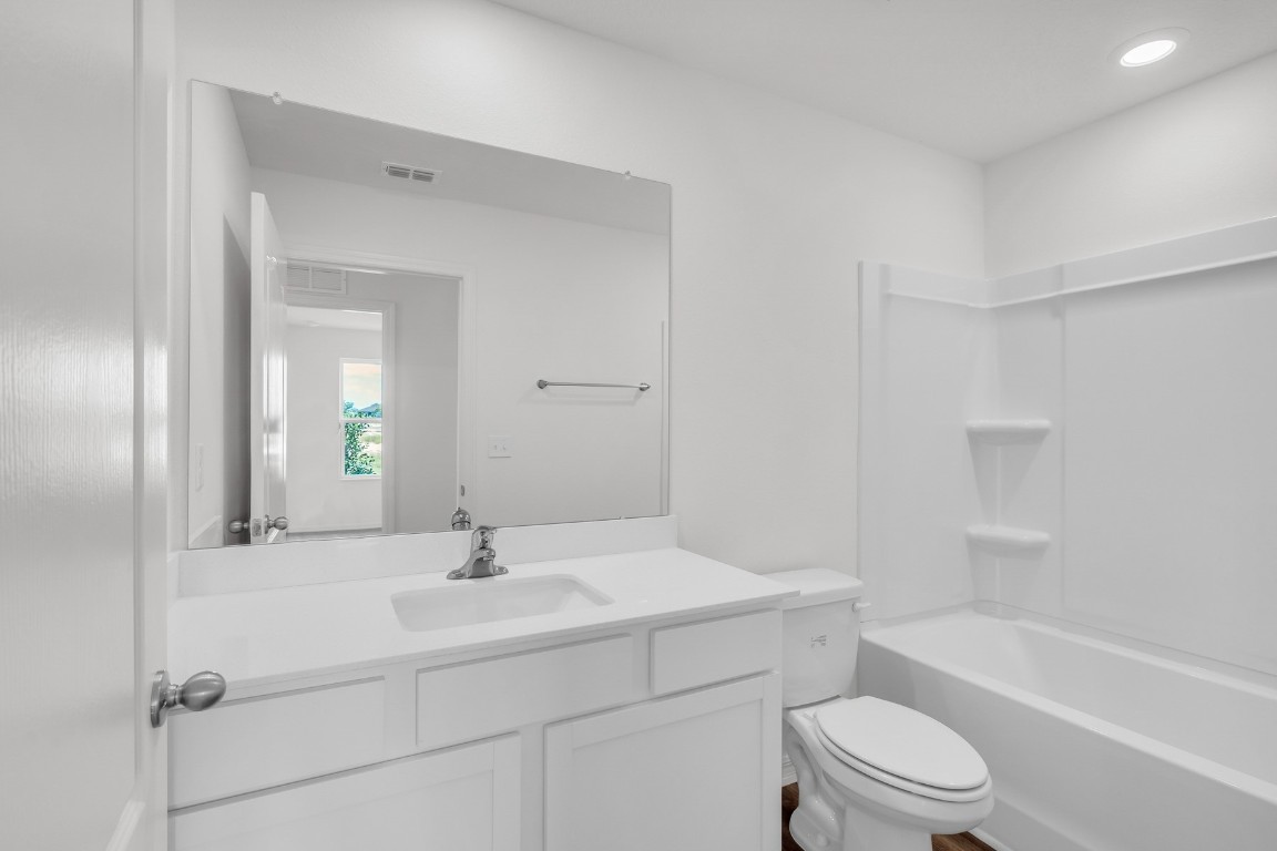 37255 Whisper Way Hilliard, FL 32046 - Photo 20 of 20 a bathroom with a sink a toilet and shower