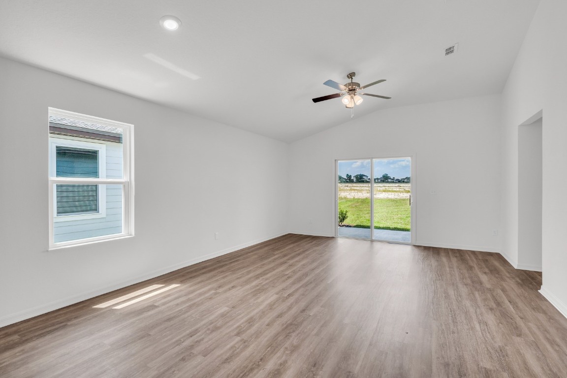 37255 Whisper Way Hilliard, FL 32046 - Photo 10 of 20 an empty room with a window and wooden floor