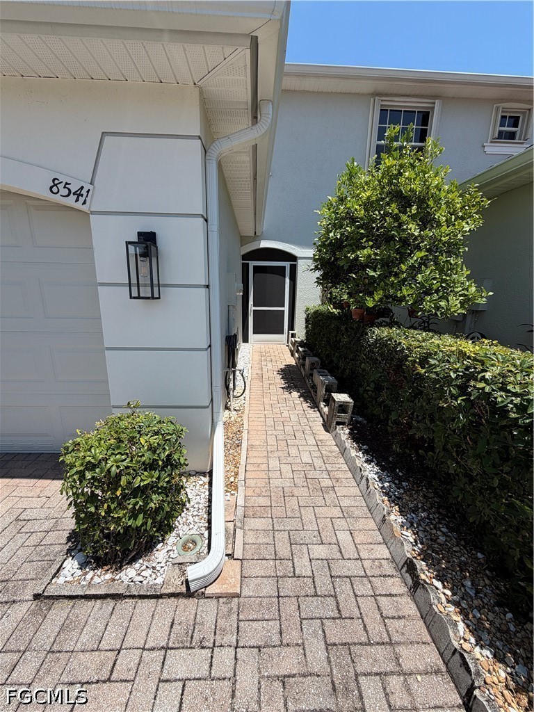 8541 Athena Court Lehigh Acres, FL 33971 - Photo 2 of 17 a front view of a house