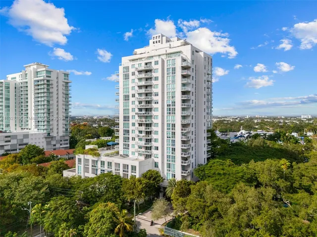 a view of a large building with a yard