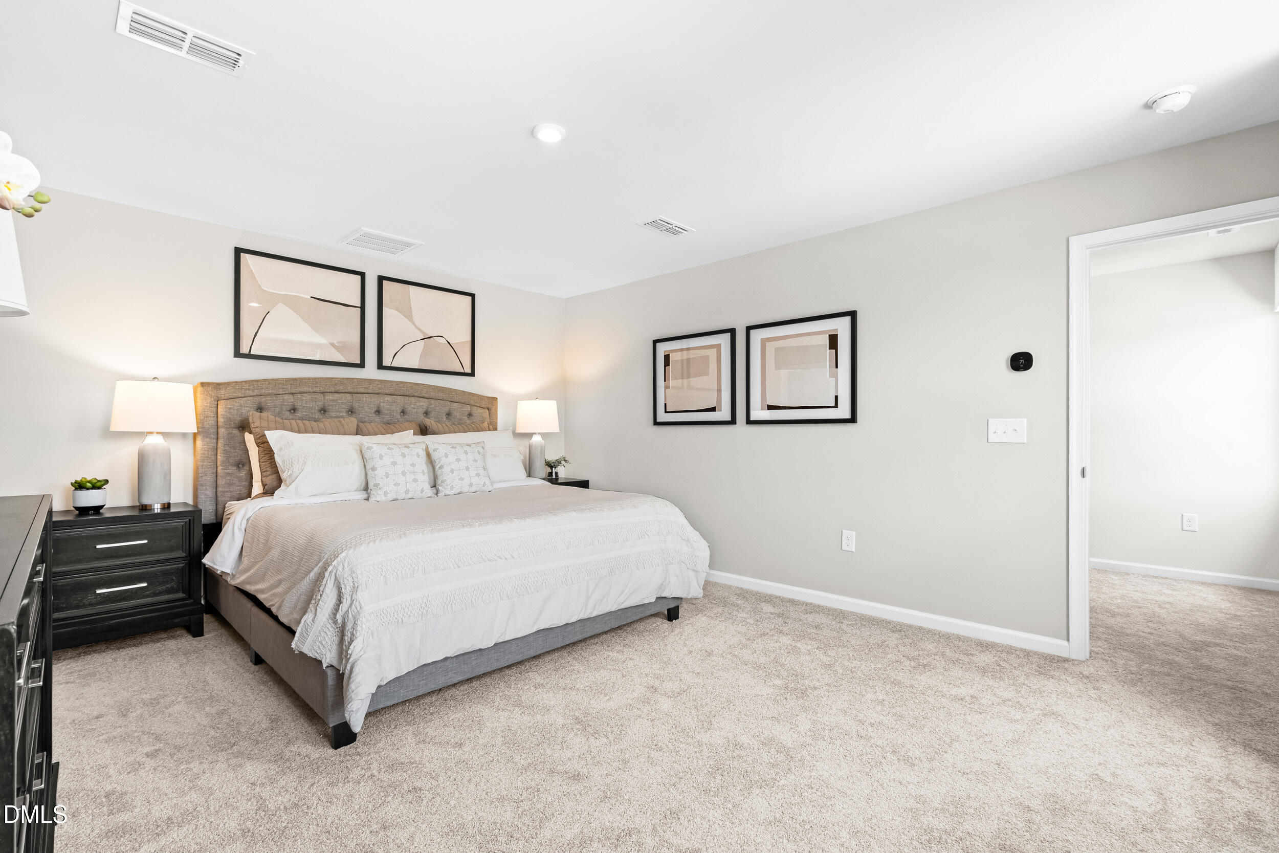 197 Brook Bawn Road Wendell, NC 27591 - Photo 15 of 33 a bedroom with a bed and a night stand