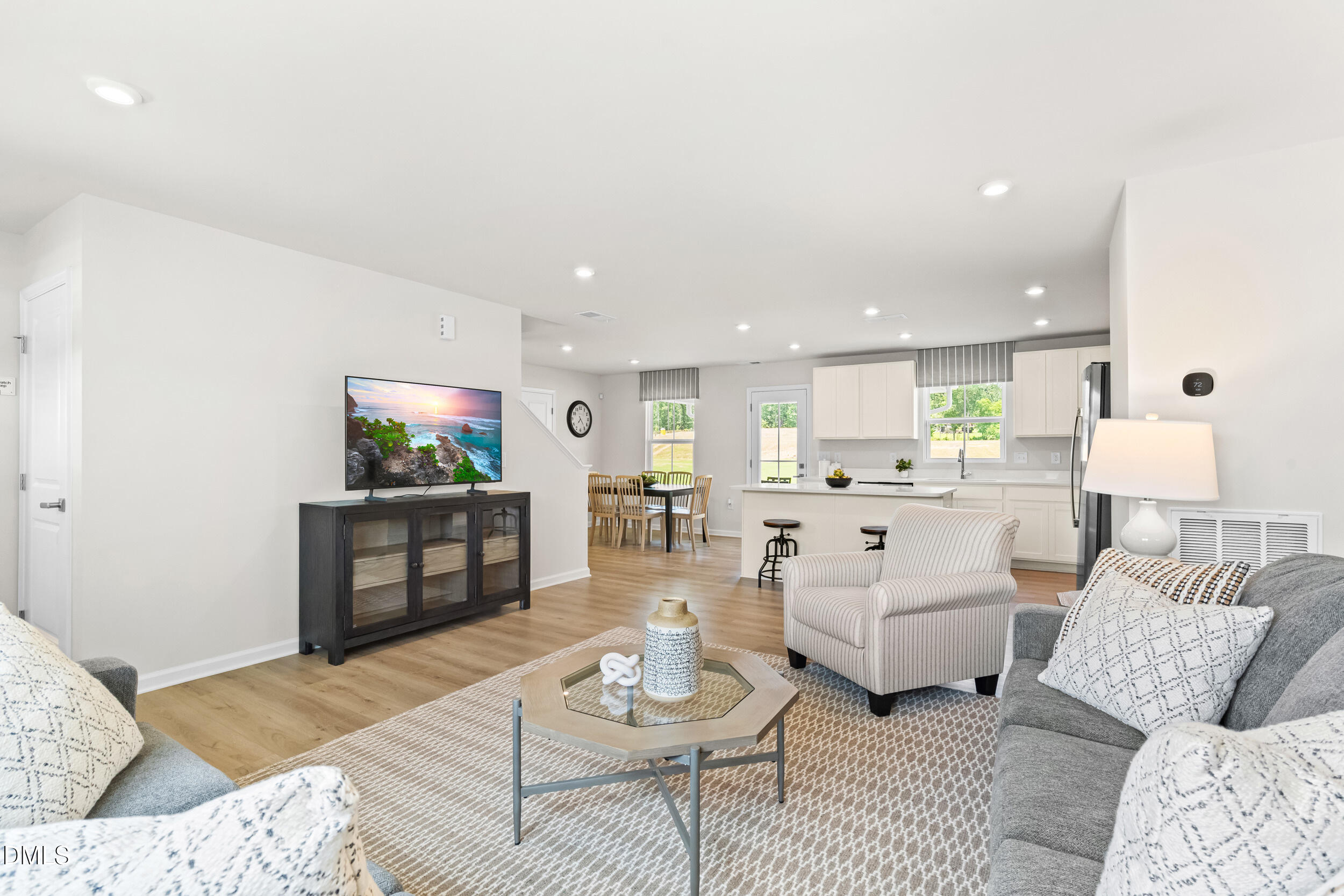 197 Brook Bawn Road Wendell, NC 27591 - Photo 8 of 33 a living room with furniture and a flat screen tv
