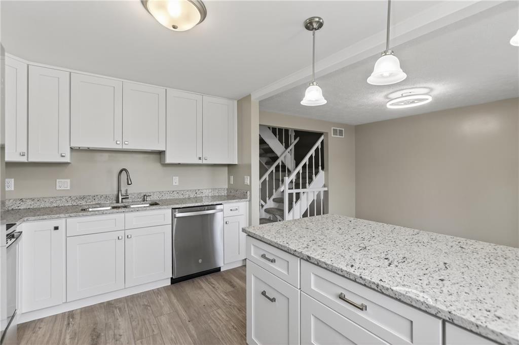 518 Hemlock Court Coraopolis, PA 15108 - Photo 13 of 34 a kitchen with a sink stainless steel appliances and cabinets