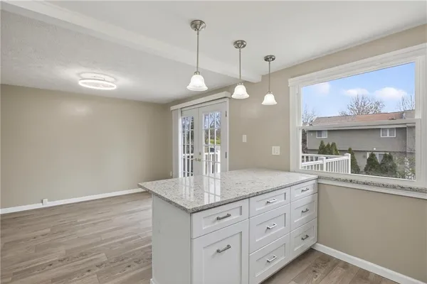 a view of a kitchen counter space and wooden floor